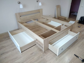 a bed with drawers and lights